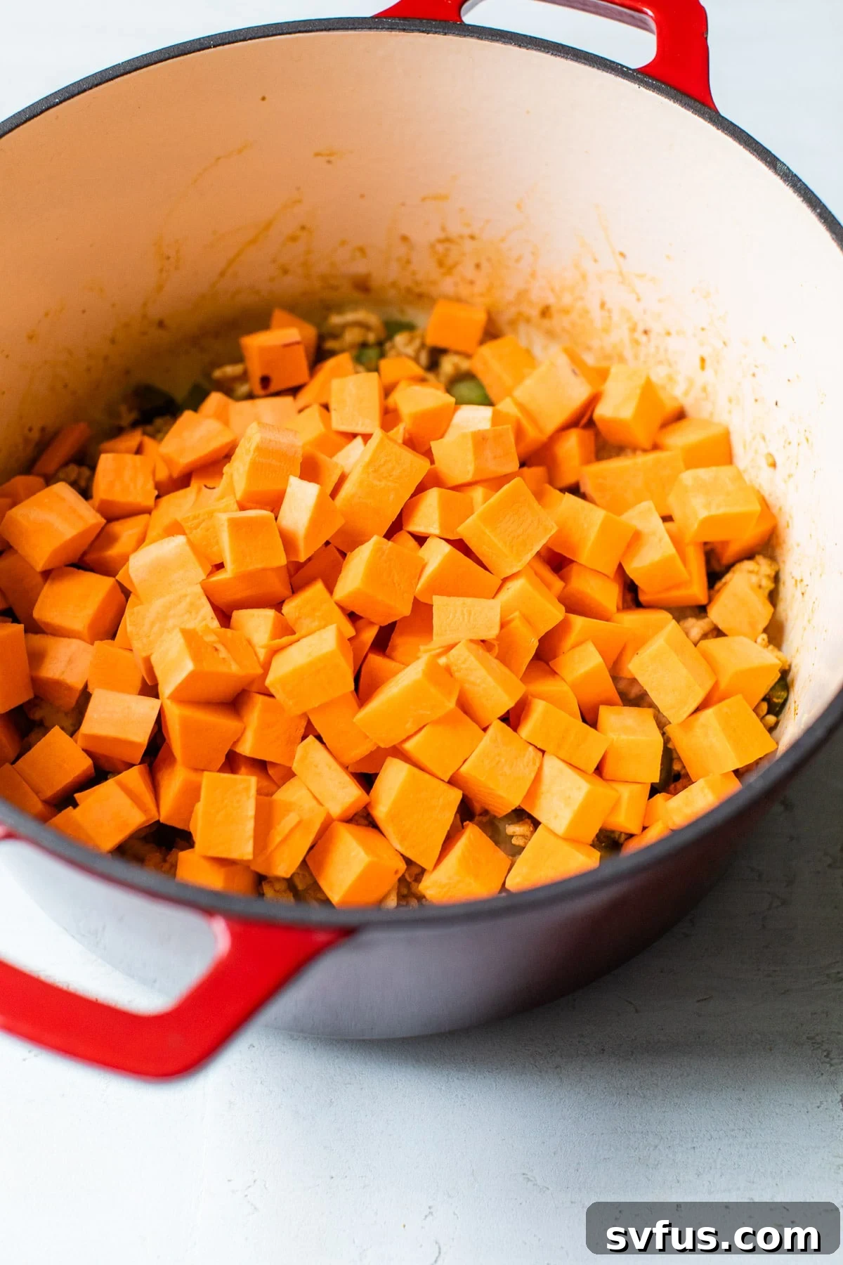 dutch oven with diced sweet potatoes