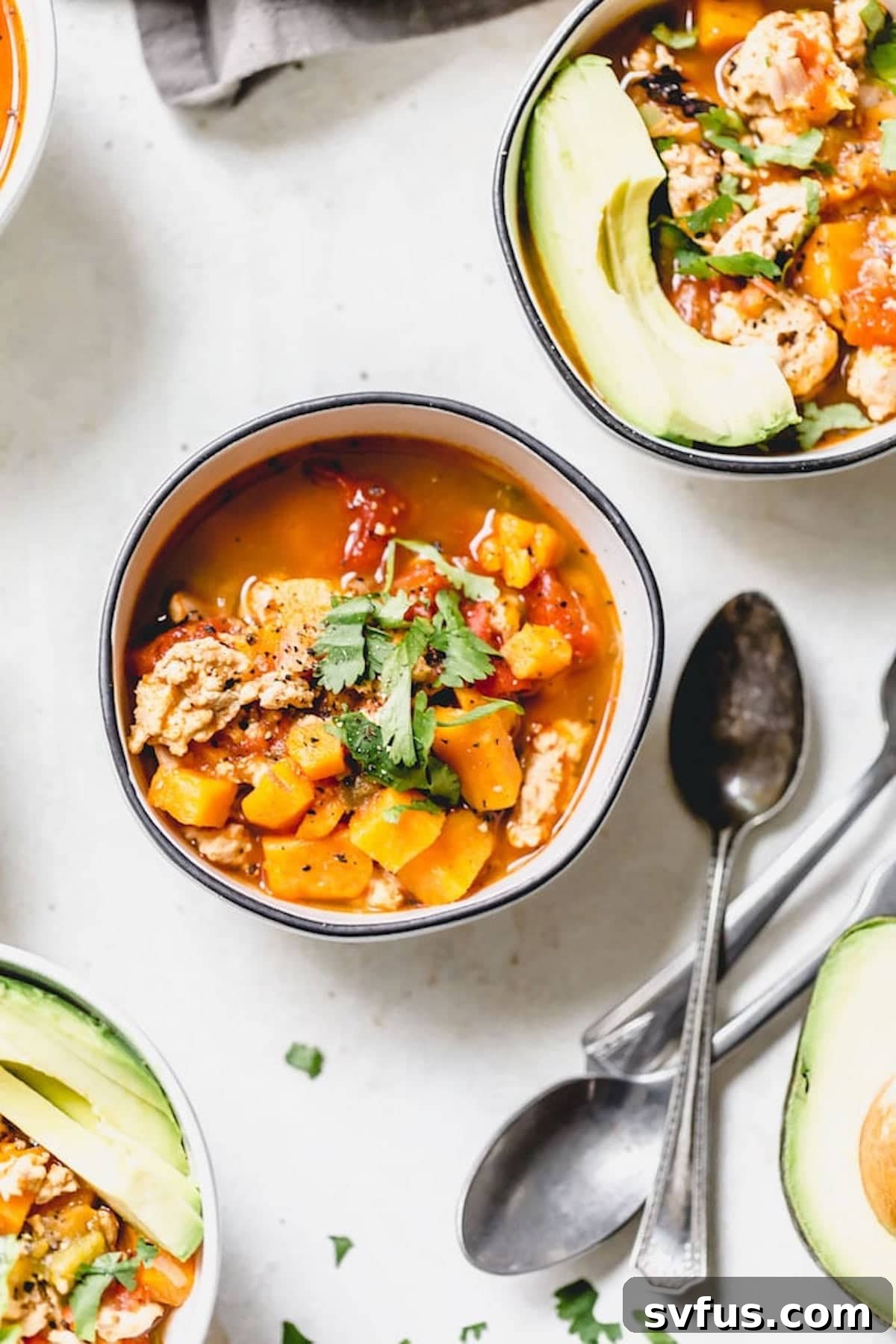 small bowls of chili with avocado