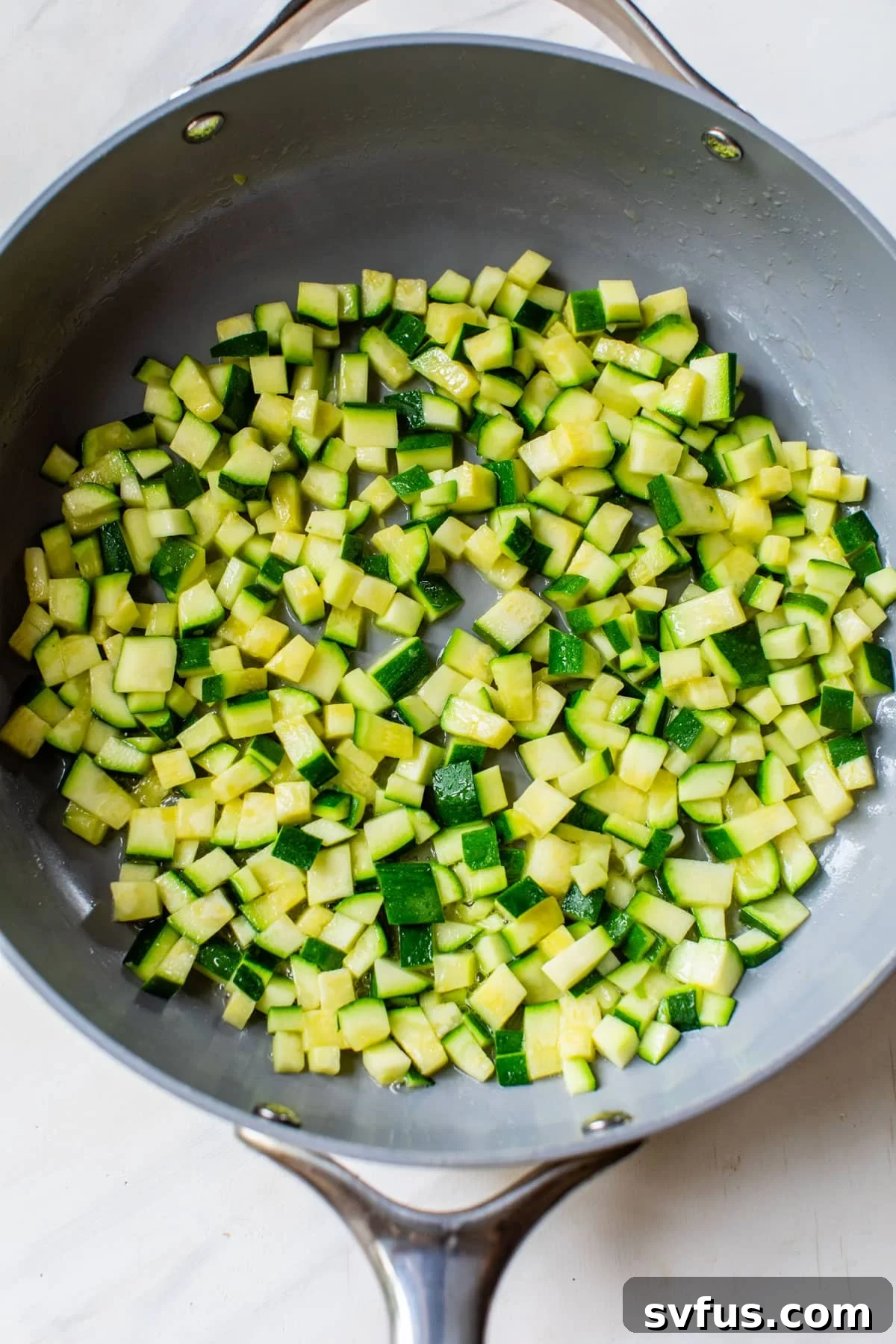 diced zucchini in a skillet
