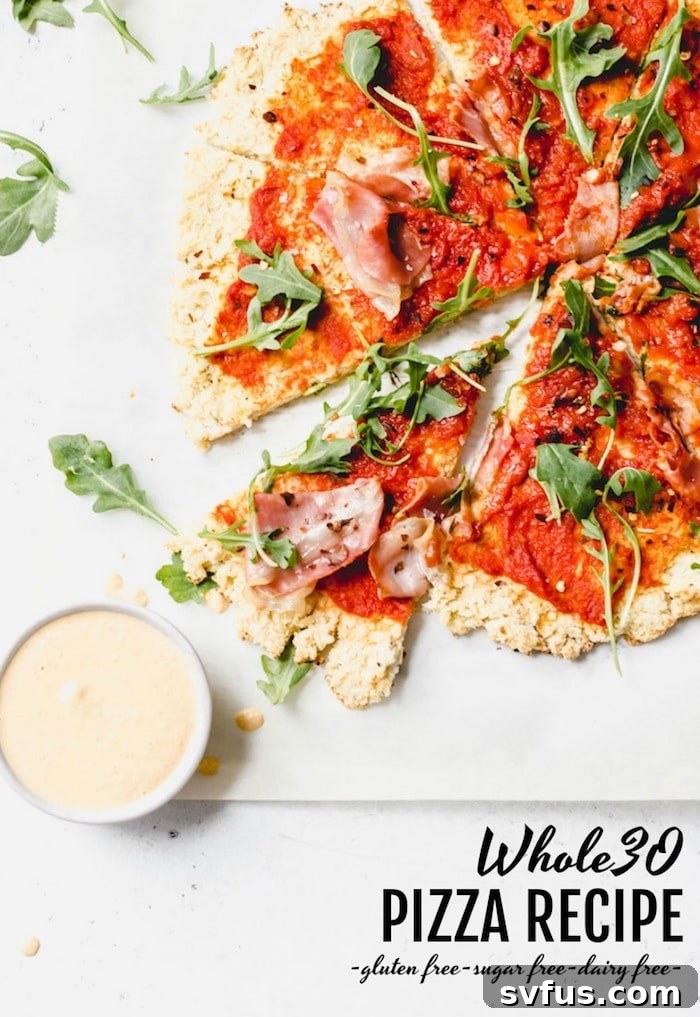 Whole30 Pizza Recipe - pizza made with cauliflower crust and topped with simple ingredients for you on your whole30! | thealmondeater.com