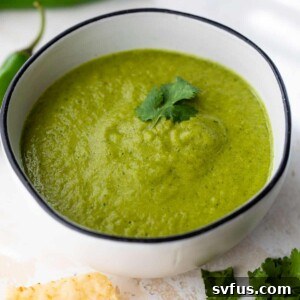 Serrano salsa in a bowl with cilantro on top, ready to serve.