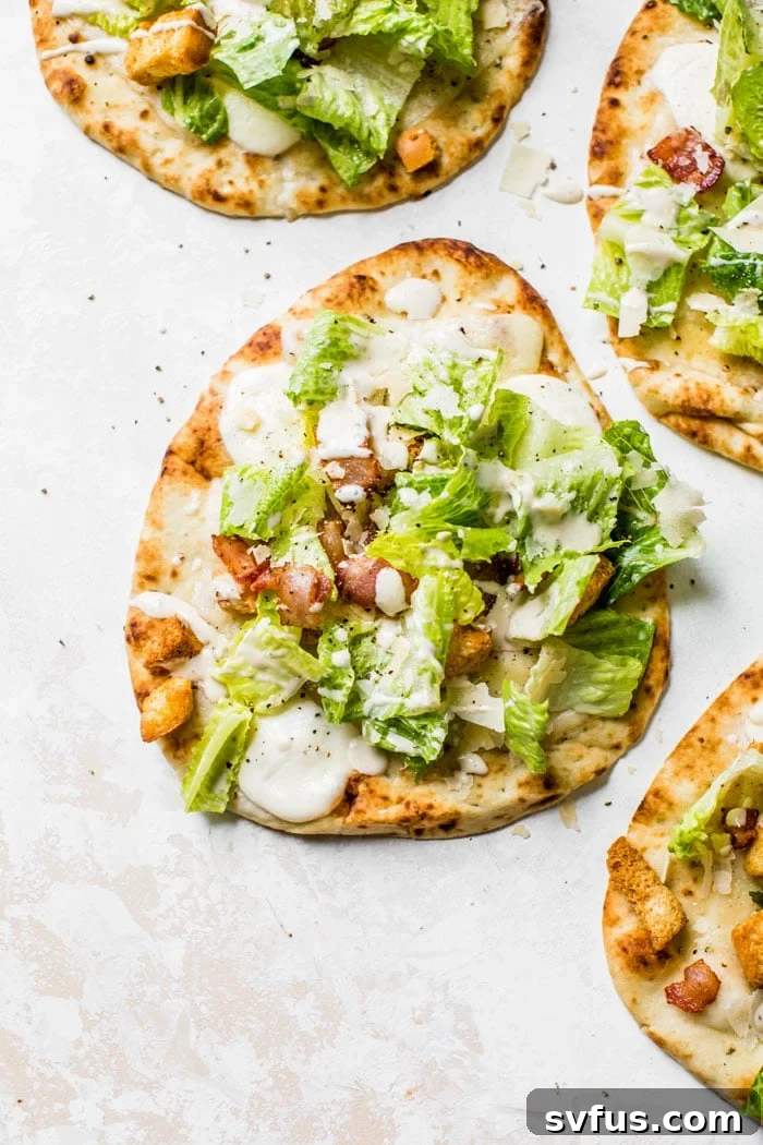 Caesar Salad Pizza made on naan bread for a single serve pizza recipe that's quick and healthy