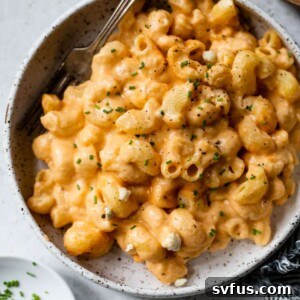 buffalo mac and cheese in a bowl with a fork
