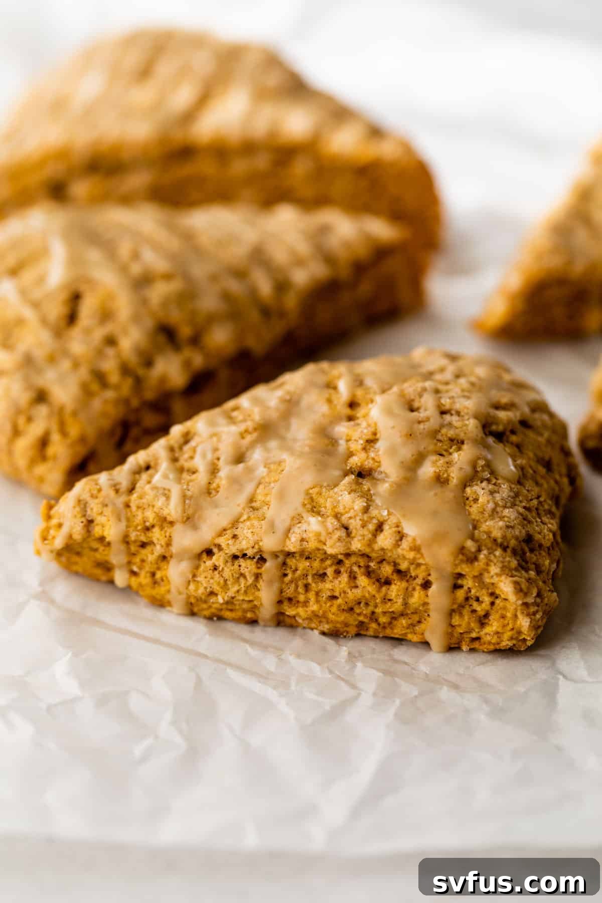 glazed scones on parchment paper