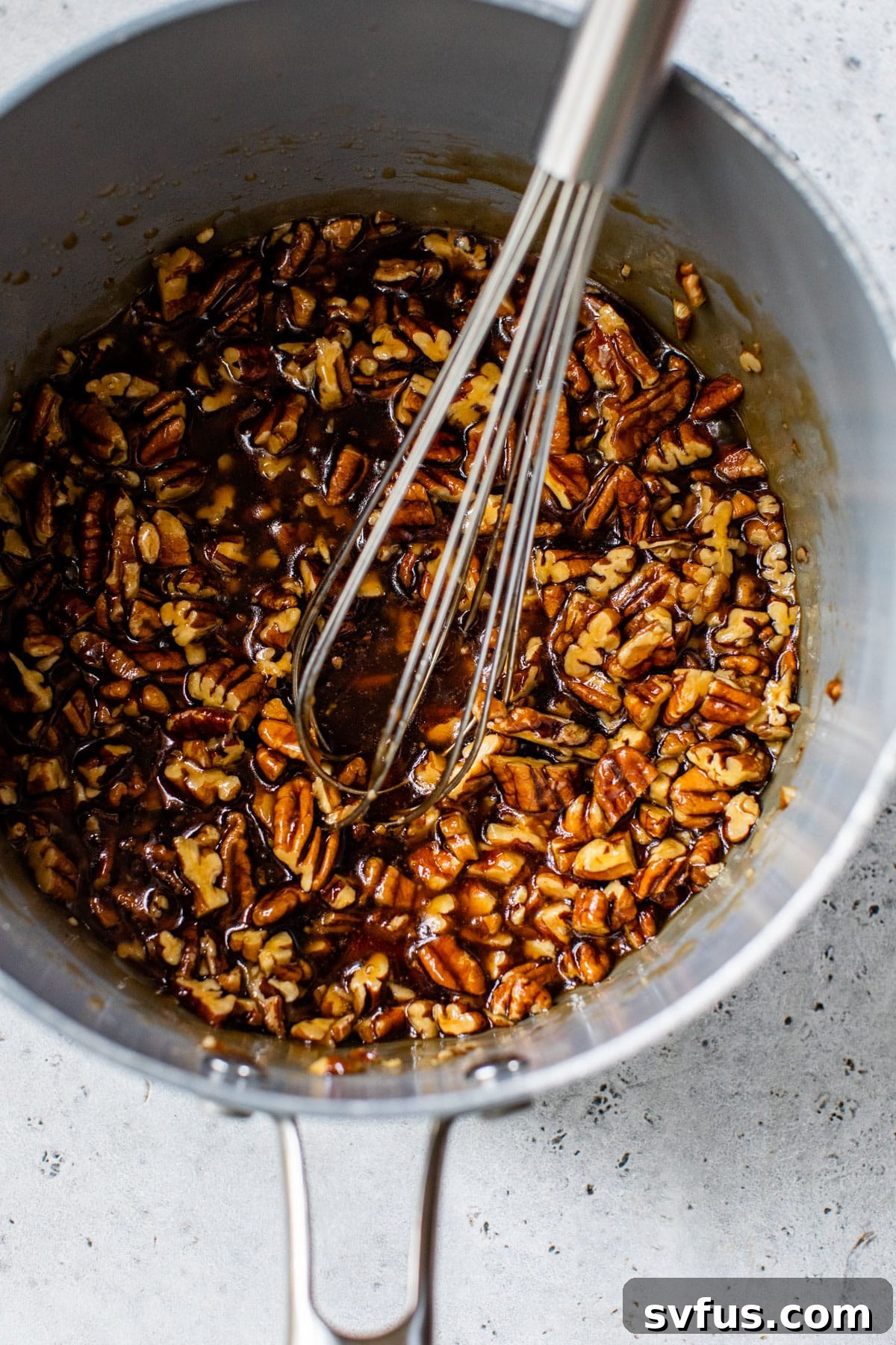 Coconut oil, maple syrup, coconut sugar, vanilla, and salt whisked together in a medium saucepan