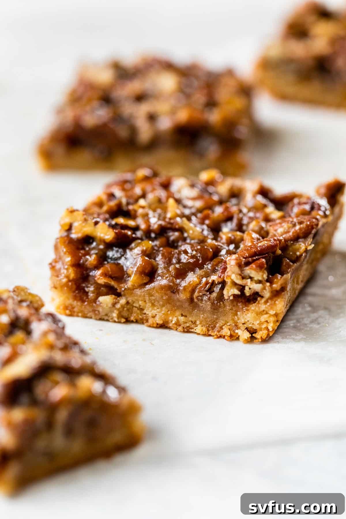 side view of healthy pecan pie bars cut into squares on a table