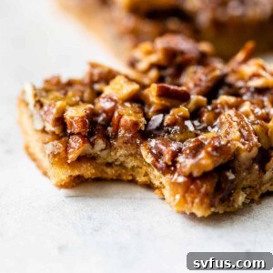 side view of a healthy pecan pie bar with a bite taken out