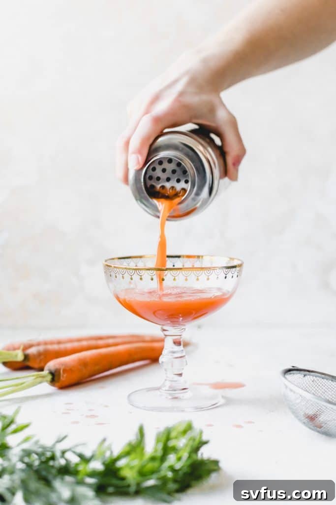 Close-up of a Carrot Juice Cocktail, showcasing the rich orange color of fresh carrot juice.