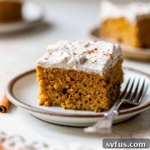 a slice of pumpkin tres leches on a plate with a fork