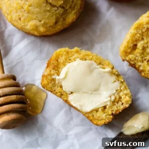 corn muffin cut in half with butter smeared on top