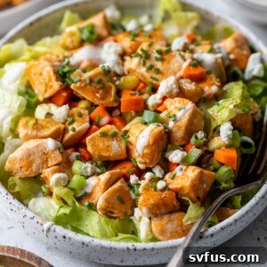 buffalo chicken salad in a bowl with a fork