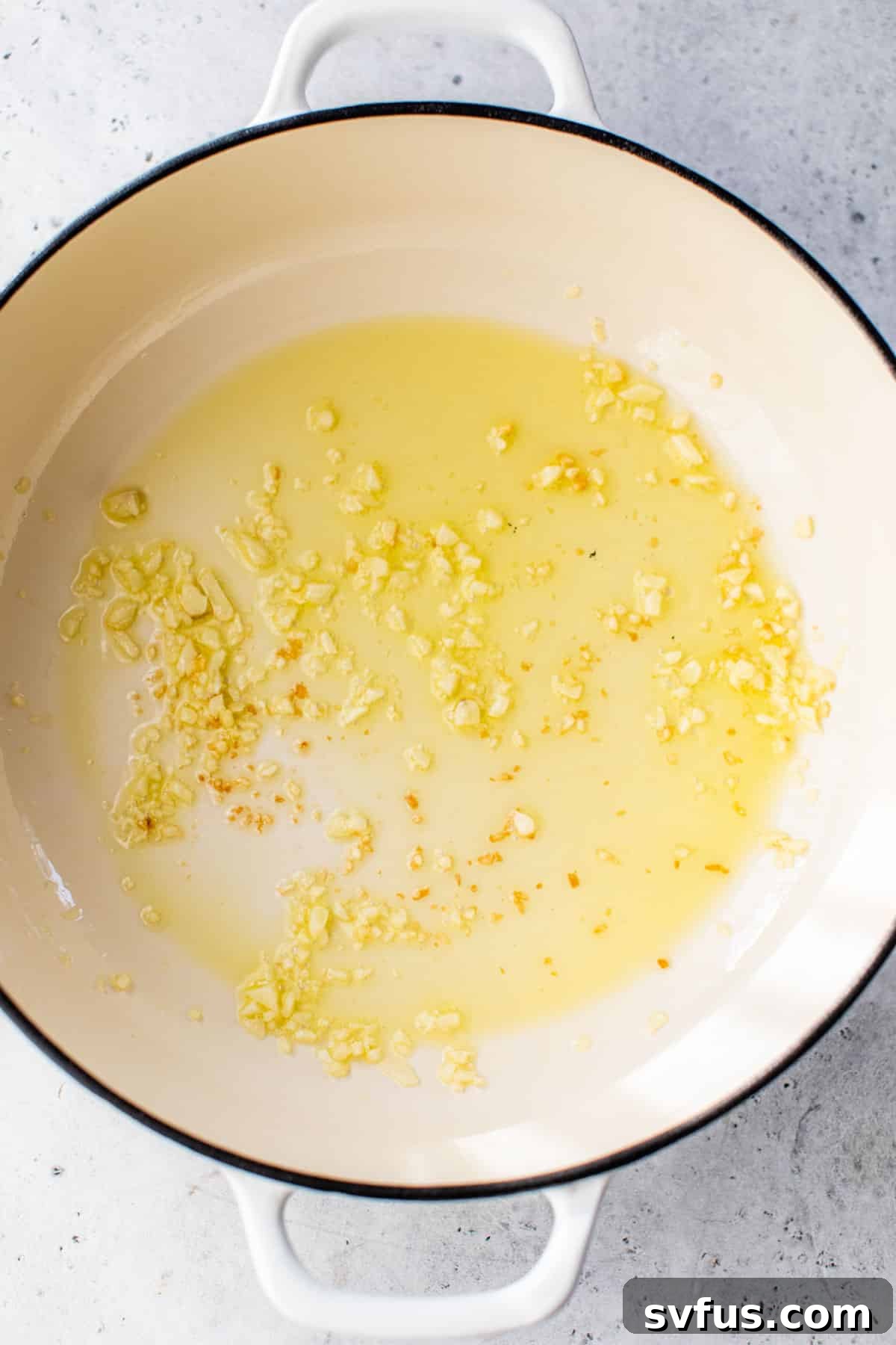 garlic sautéing in olive oil in a dutch oven