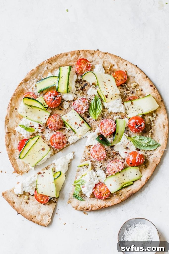 Delicious Weeknight Veggie Pizza loaded with fresh vegetables and melted cheese, ready to be served
