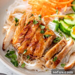 Sliced lemongrass chicken served over rice noodles