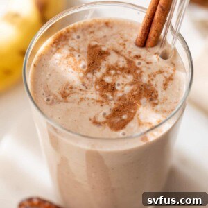 date smoothie in a glass with a straw and cinnamon stick
