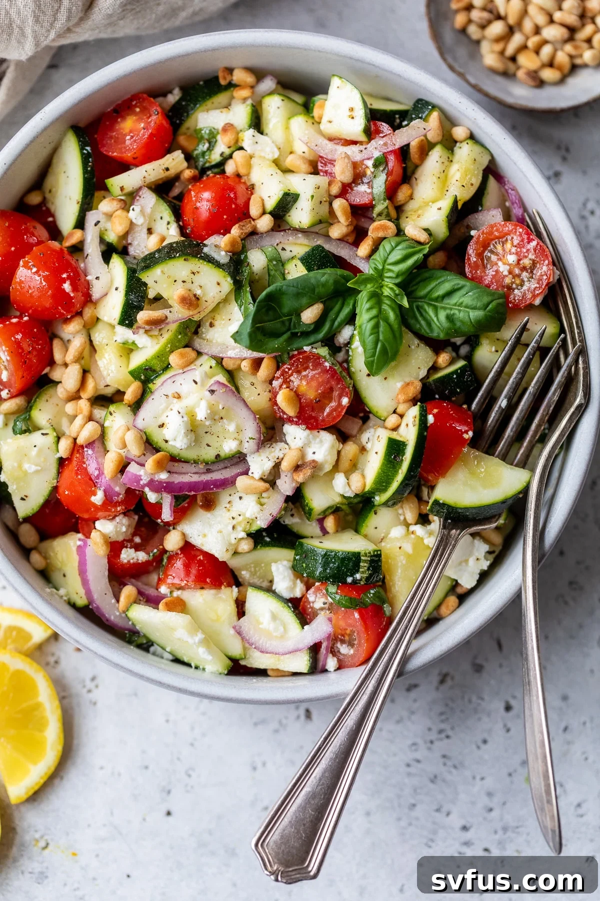 zucchini salad in a bowl with a fork