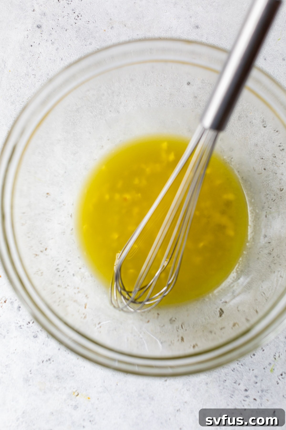 all dressing ingredients whisked together in a bowl