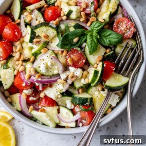 zucchini salad in a bowl with a fork