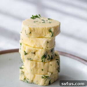 garlic butter rounds stacked on a plate
