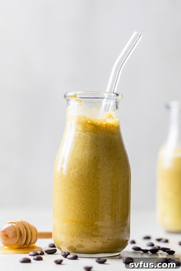 yellow smoothie in a glass