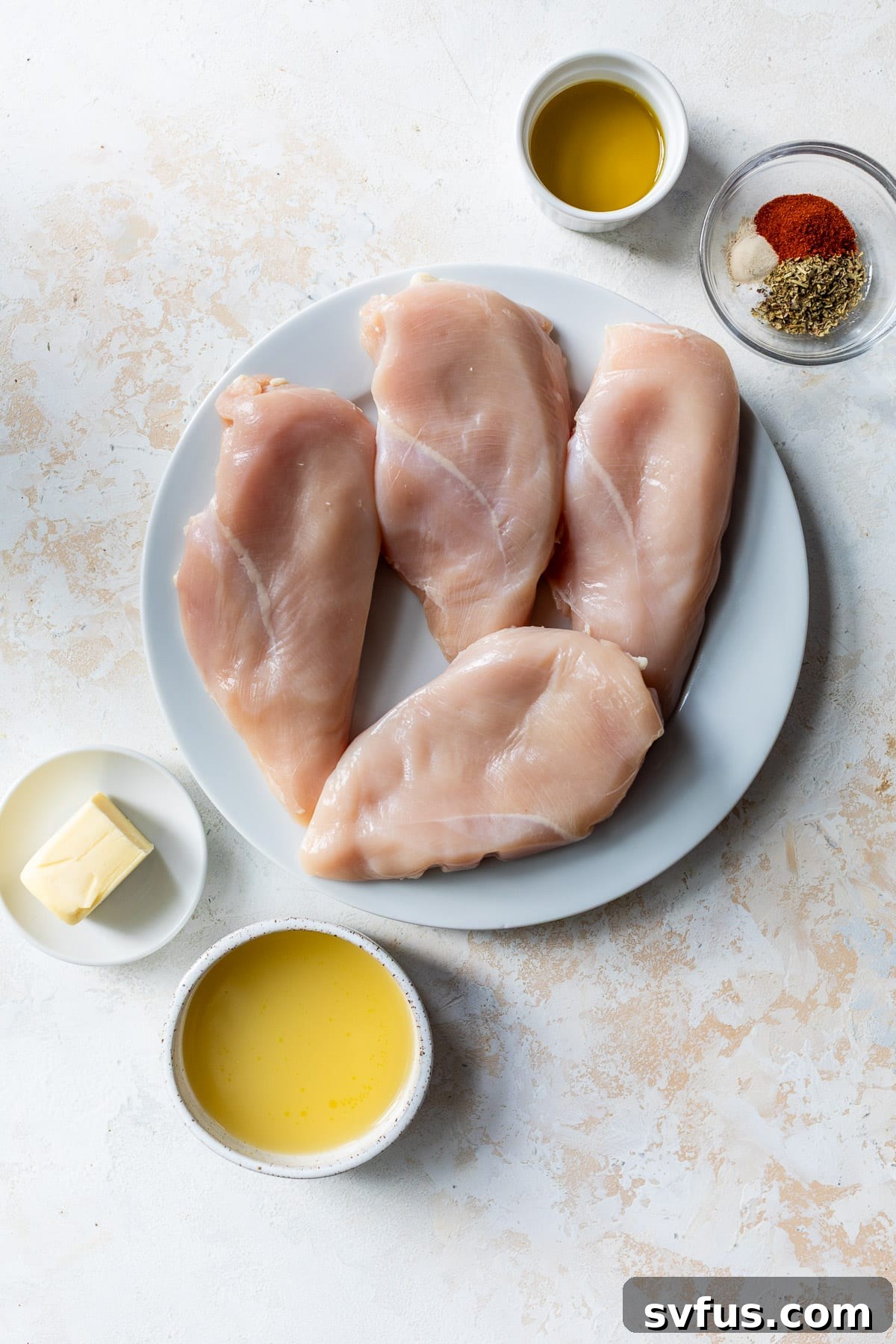 ingredients for a Slow Cooker Chicken Breast recipe in individual bowls and plates.