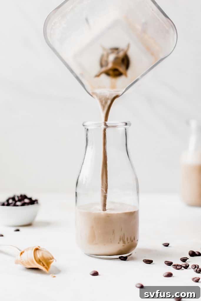 A close-up of a refreshing cold brew coffee smoothie, highlighting its smooth consistency and inviting color.