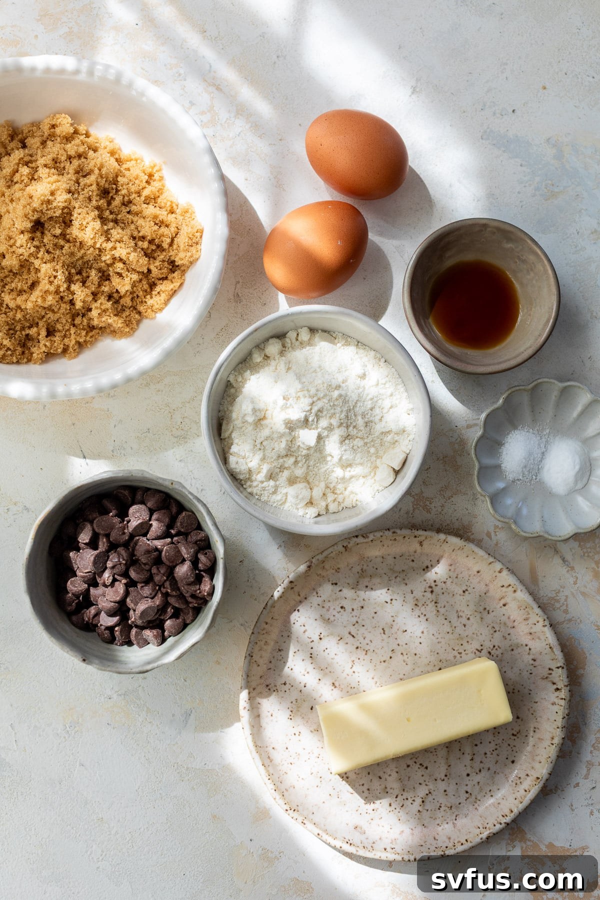 Individual bowls containing the ingredients for Coconut Flour Cookies, laid out neatly.