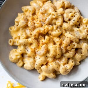 overhead view of a bowl filled with cottage cheese mac and cheese, perfectly creamy.