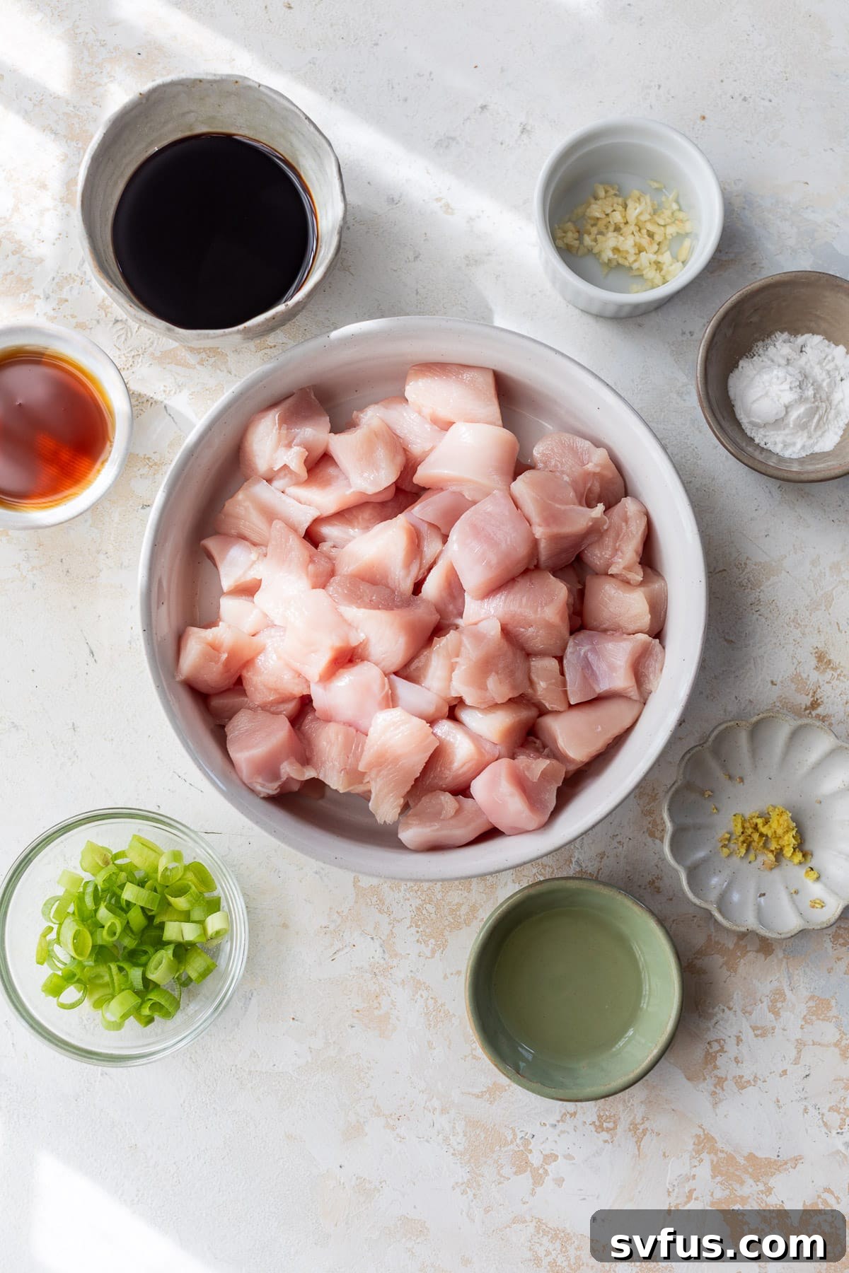 Ingredients for homemade teriyaki chicken arranged in individual white bowls.