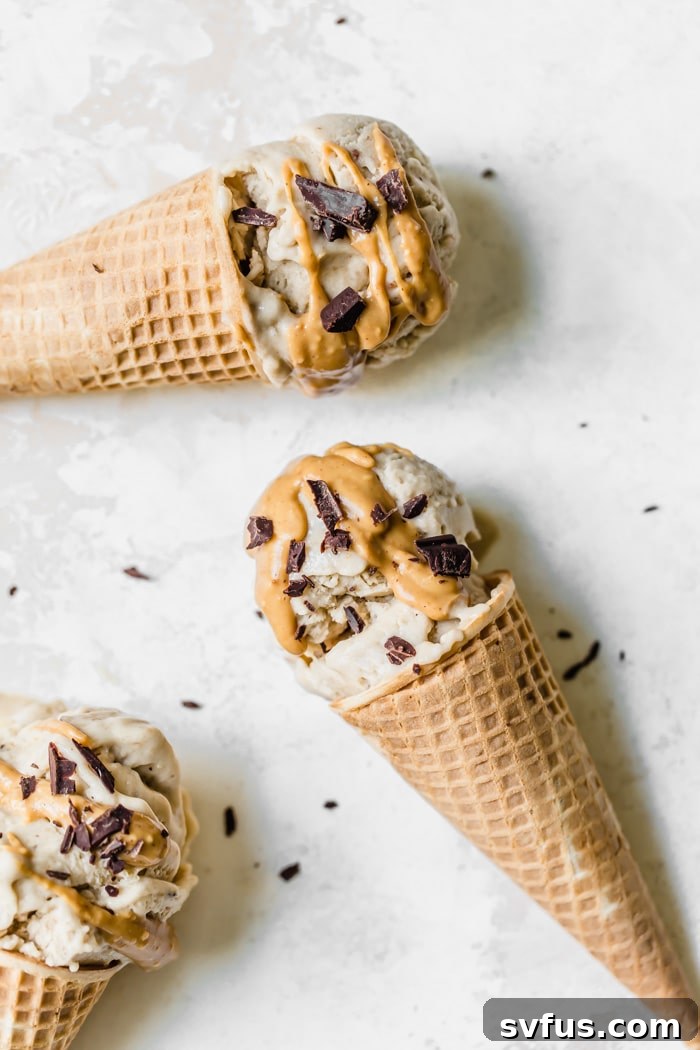Three servings of peanut butter banana nice cream in waffle cones