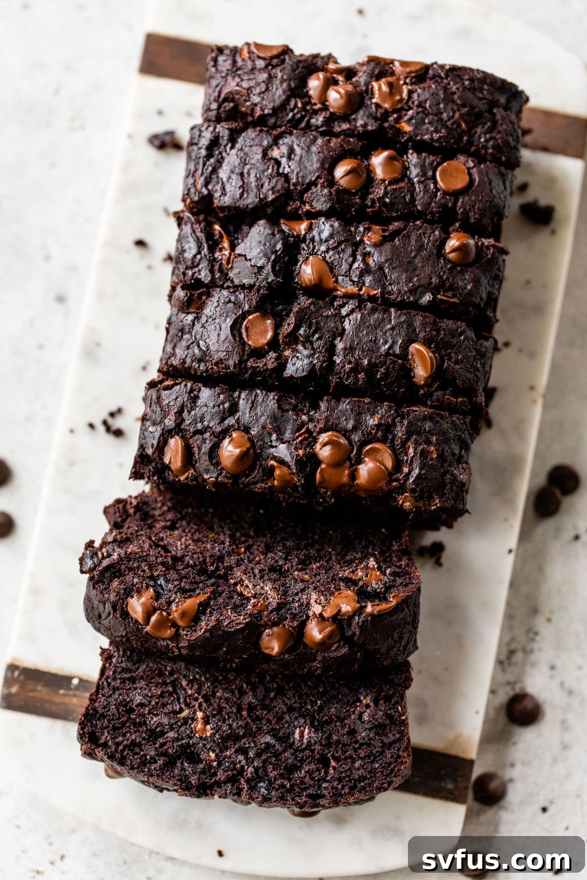 vegan chocolate zucchini bread loaf with slices cut through the loaf
