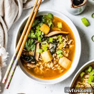 overhead view of a bowl of vegan ramen with chopsticks on top.
