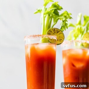 Skinny Bloody Mary in a small glass with lime garnish
