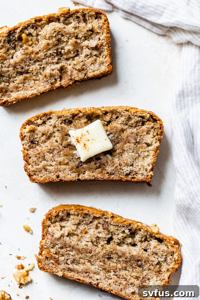 Deliciously moist vegan banana bread loaf, sliced and ready to enjoy, perfect for breakfast or snack