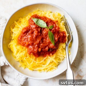 A perfectly cooked spaghetti squash, ready to be scooped into delicious, pasta-like strands, highlighting the successful outcome of the Instant Pot method.
