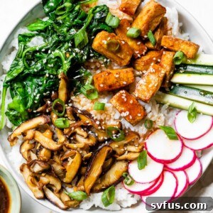 a large bowl of bibimbap made with tofu instead of beef