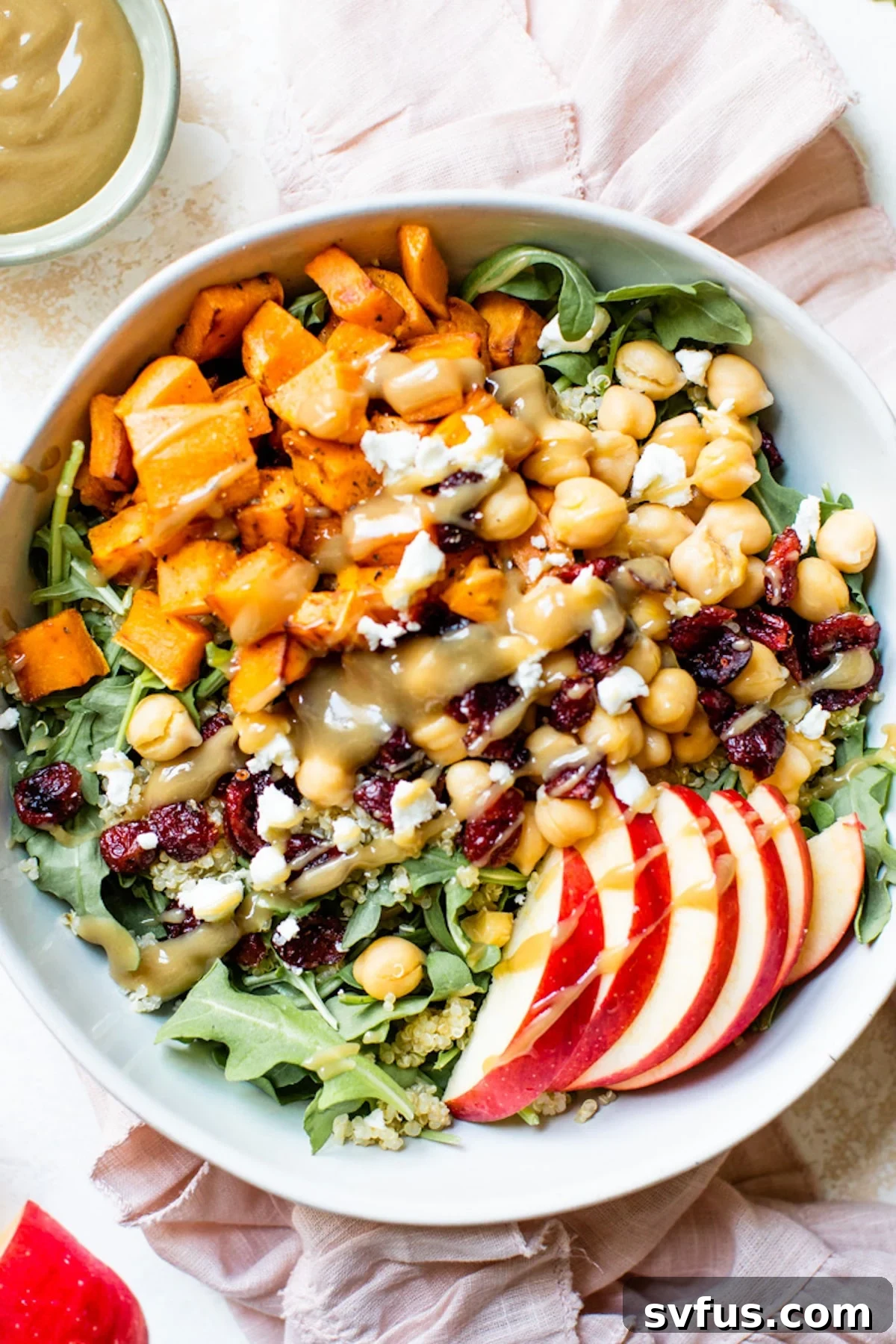 A bowl of food with Quinoa and Salad