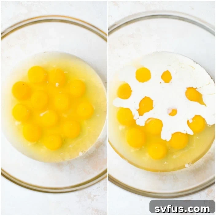 A close-up of whisked eggs and heavy cream in a clear glass bowl, ready for mixing with other ingredients