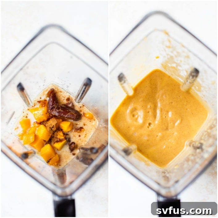 Close-up of a blender pitcher filled with vibrant orange butternut squash smoothie ingredients before blending.
