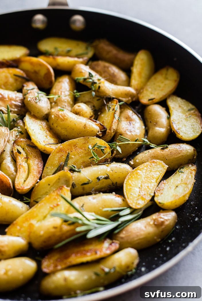 Crispy Skillet Roasted Potatoes, showing beautifully browned and tender potatoes, proving you CAN roast potatoes on the skillet until they're perfectly crispy and delicious. A quick and easy side dish.