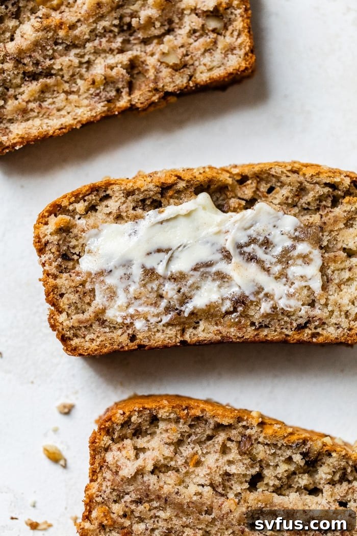 A delectable loaf of The BEST Vegan Banana Bread, crafted with all-purpose flour and dairy-free butter. This easy-to-prep, perfectly moist, and delicious recipe is ideal for breakfast or a satisfying snack, showcasing its rich, golden-brown crust.
