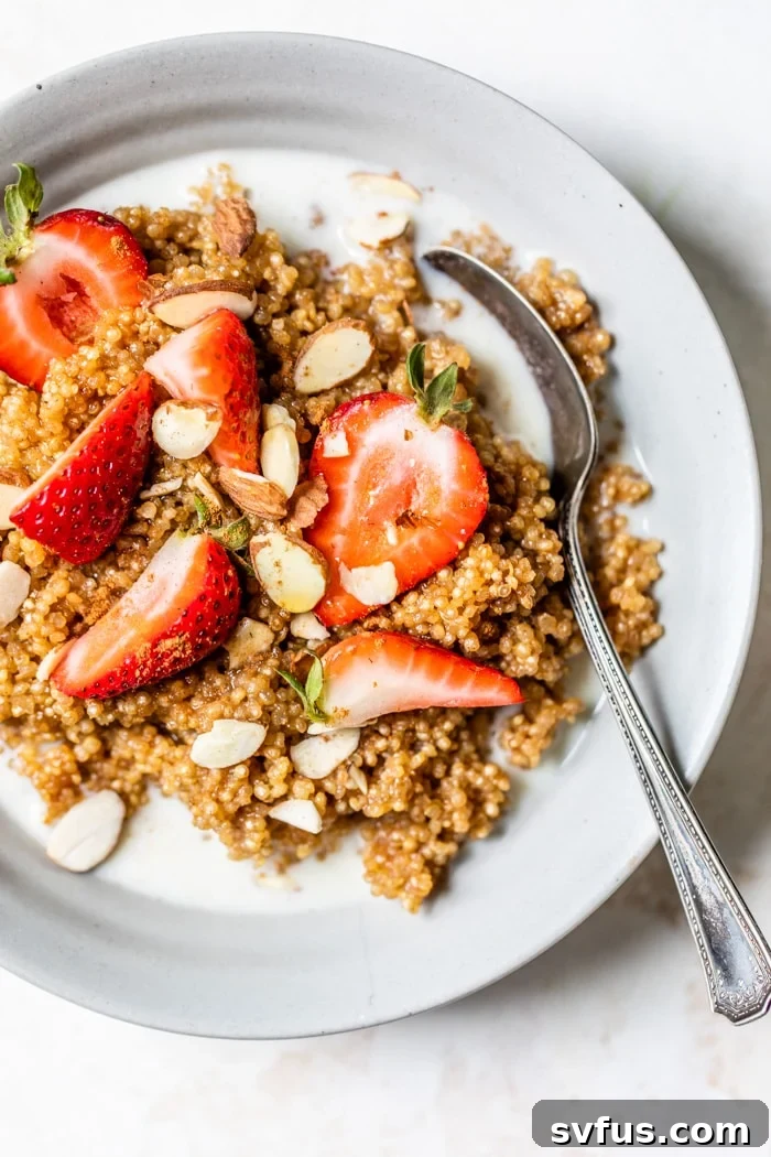 An inviting image of a Quinoa Breakfast Bowl, brimming with warm cinnamon flavor and ready in just 15 minutes. This healthy and protein-packed breakfast is an excellent alternative to traditional oatmeal.
