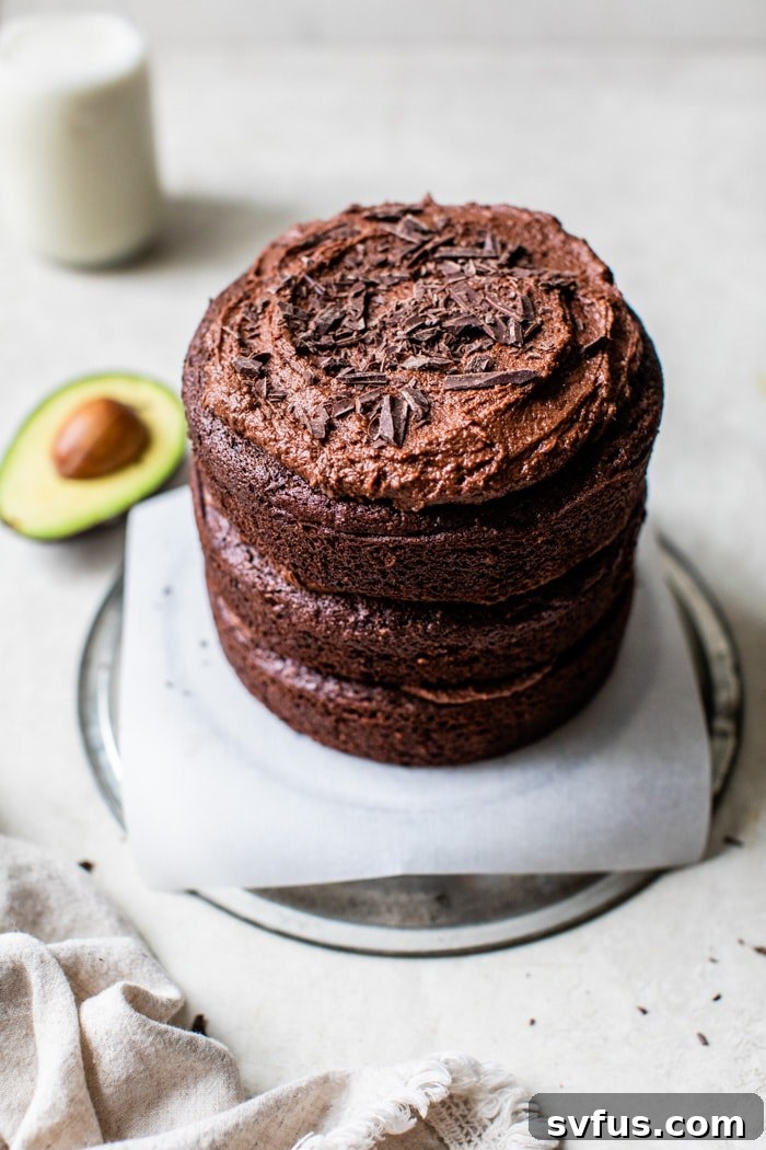 A beautiful three-tier gluten-free chocolate avocado cake, ready for serving.