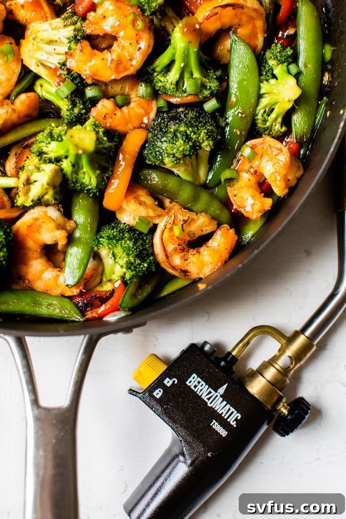 shrimp and vegetables in a skillet