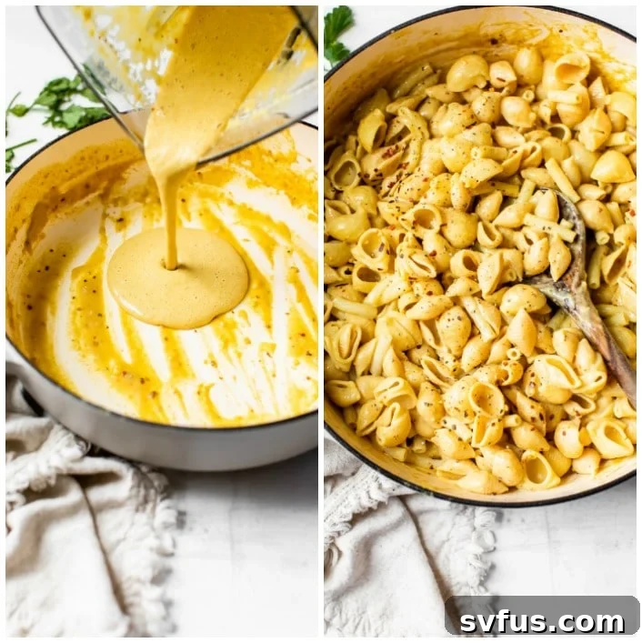 Creamy vegan cheese sauce being poured from a blender into a Dutch oven