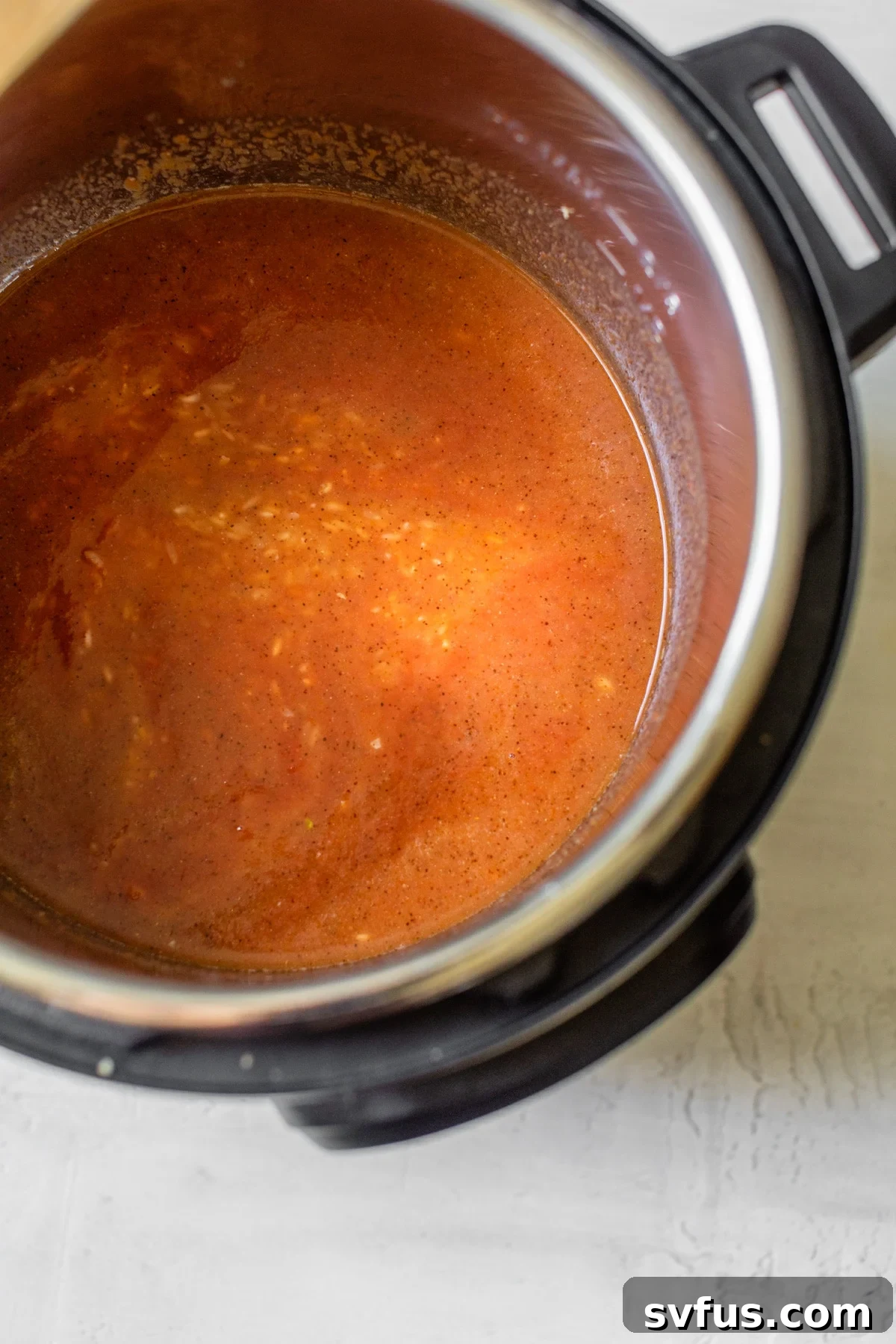 rice and broth in a pressure cooker