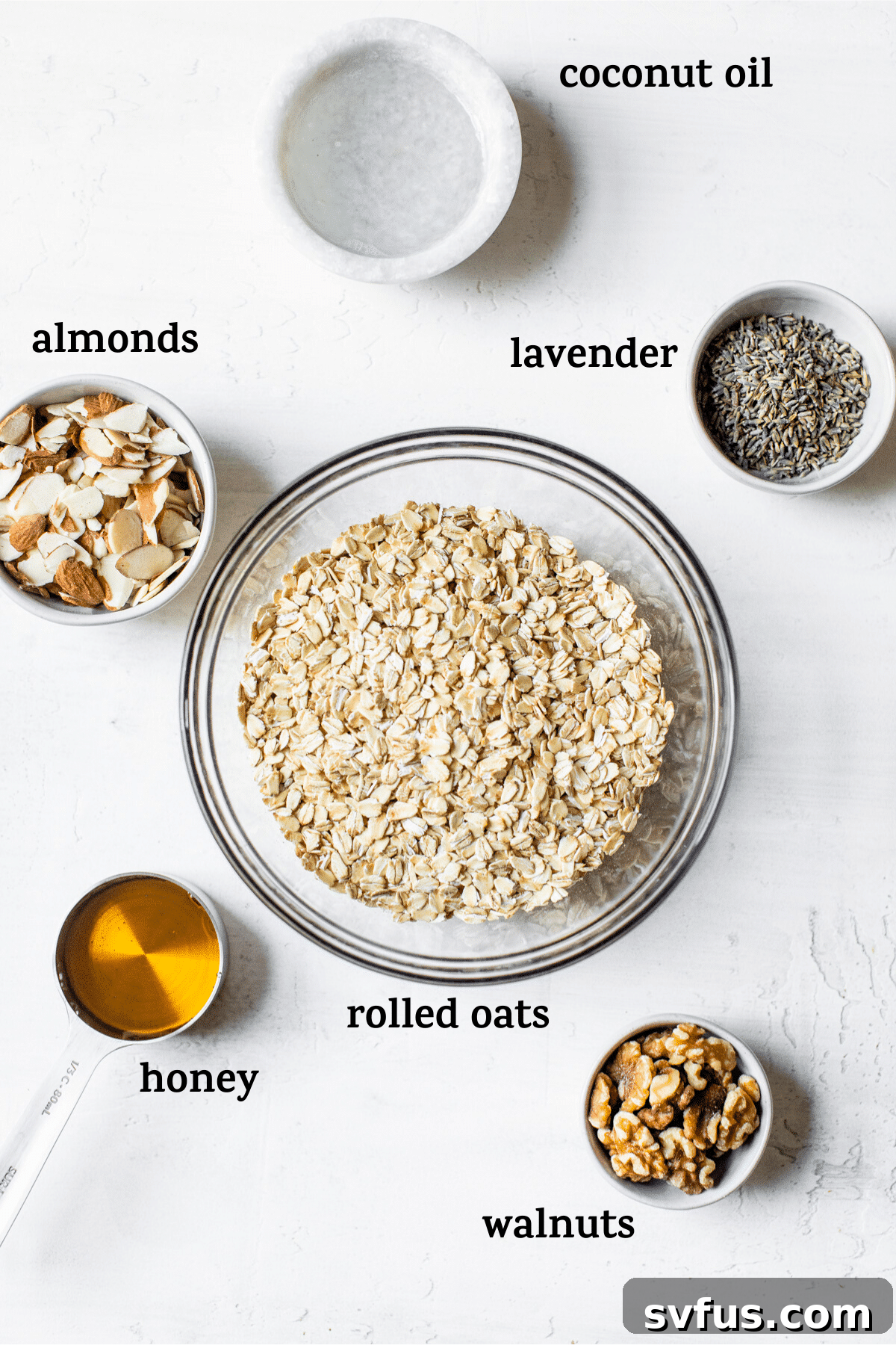 Ingredients for homemade lavender granola, including oats, nuts, and culinary lavender