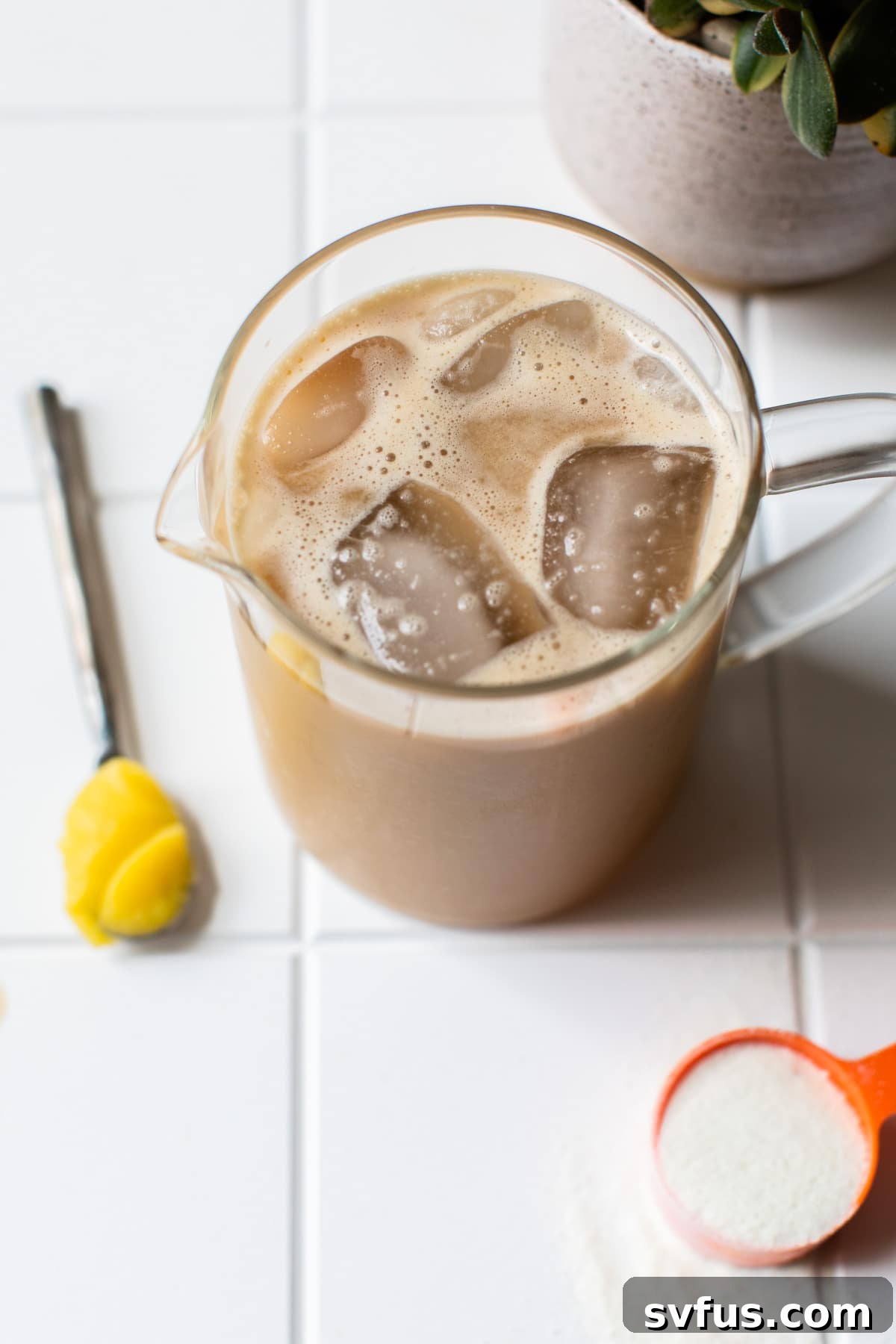 A refreshing glass of Iced Bulletproof Coffee with ice, ready to drink and energize your day