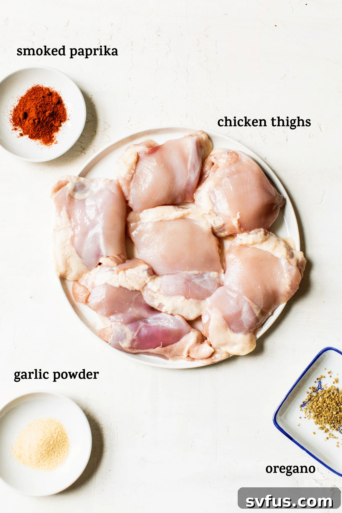 raw chicken thighs on a plate