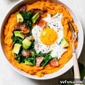 sweet potatoes topped with bacon, egg, spinach, and avocado